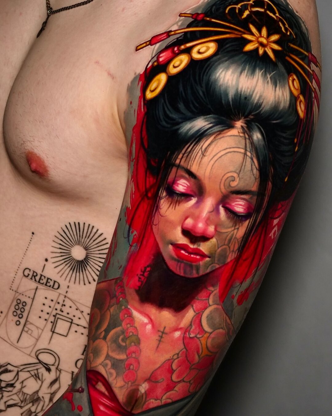 Color realism tattoo of an East Asian woman with floral details