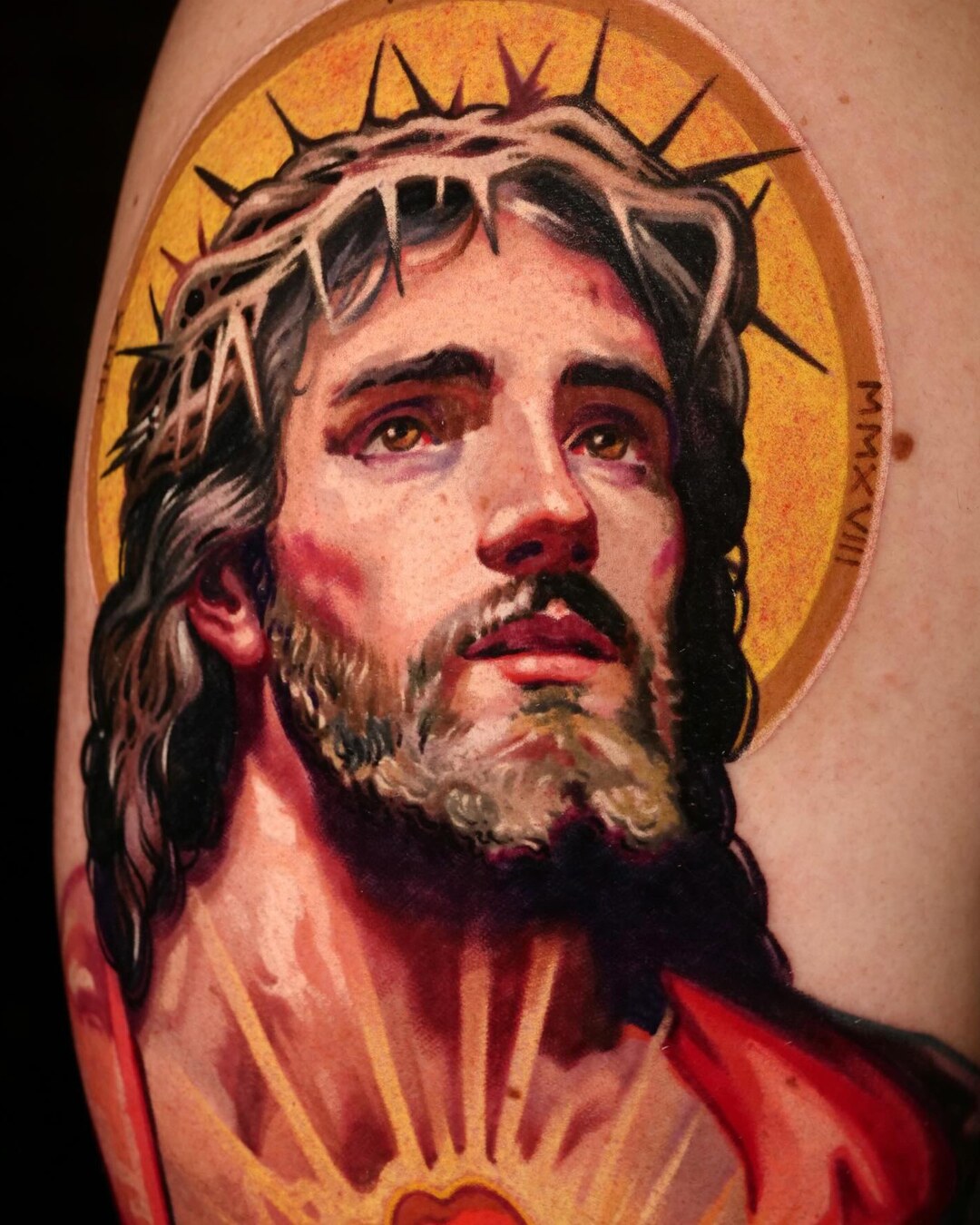 Color realism portrait tattoo of Jesus wearing a crown of thorns